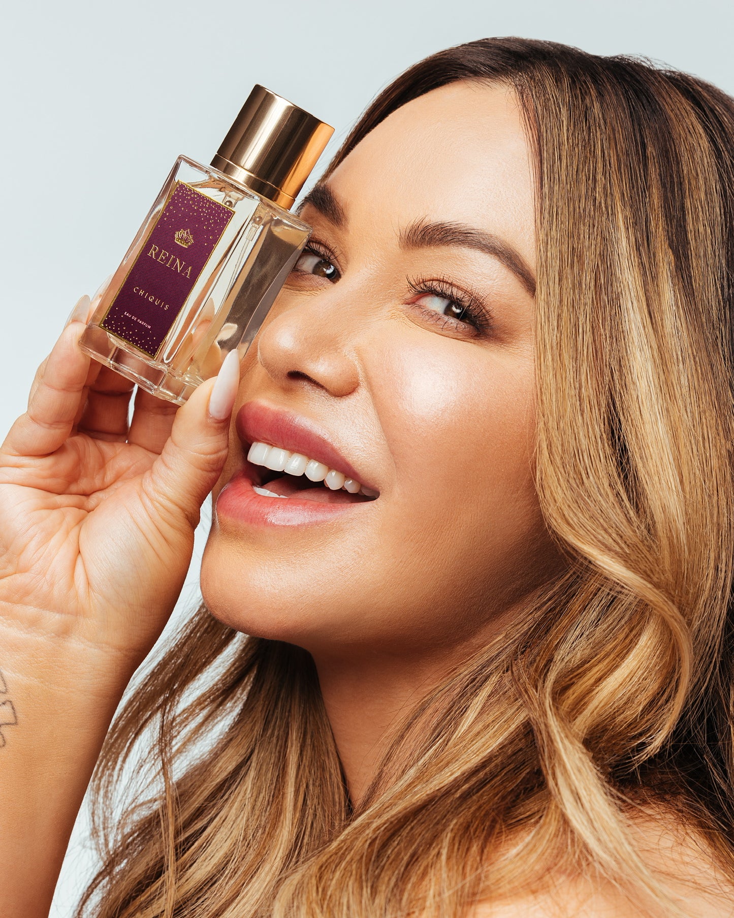 Reina Fragrance by Chiquis